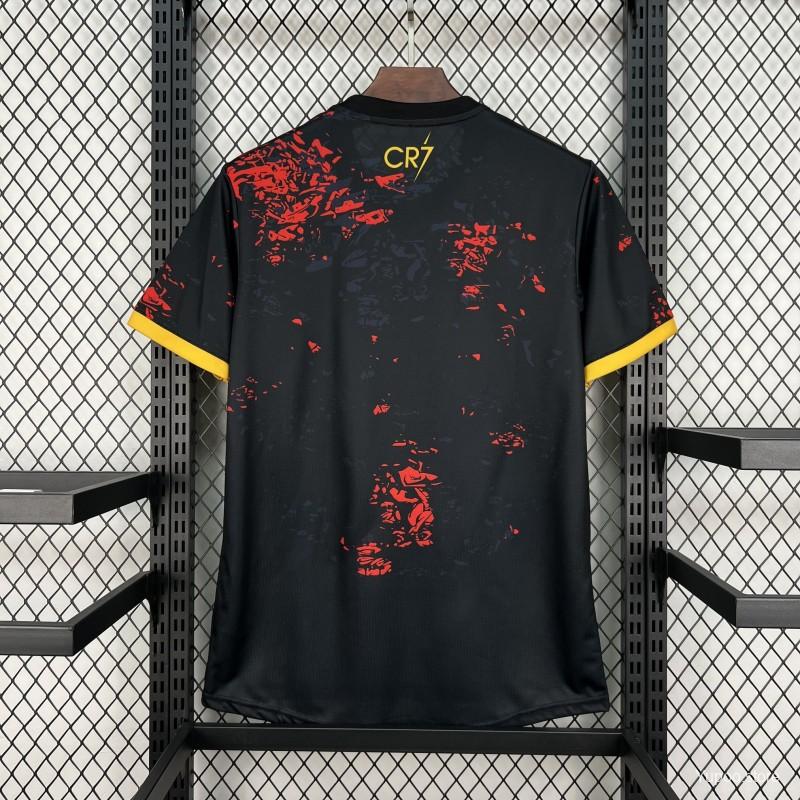 Black sports jersey with red patterns and 'CR7' branding on a hanger against a grid background.
