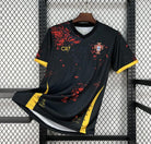 Black sports jersey with red and yellow accents, featuring a logo and text, on a black metal rack.
