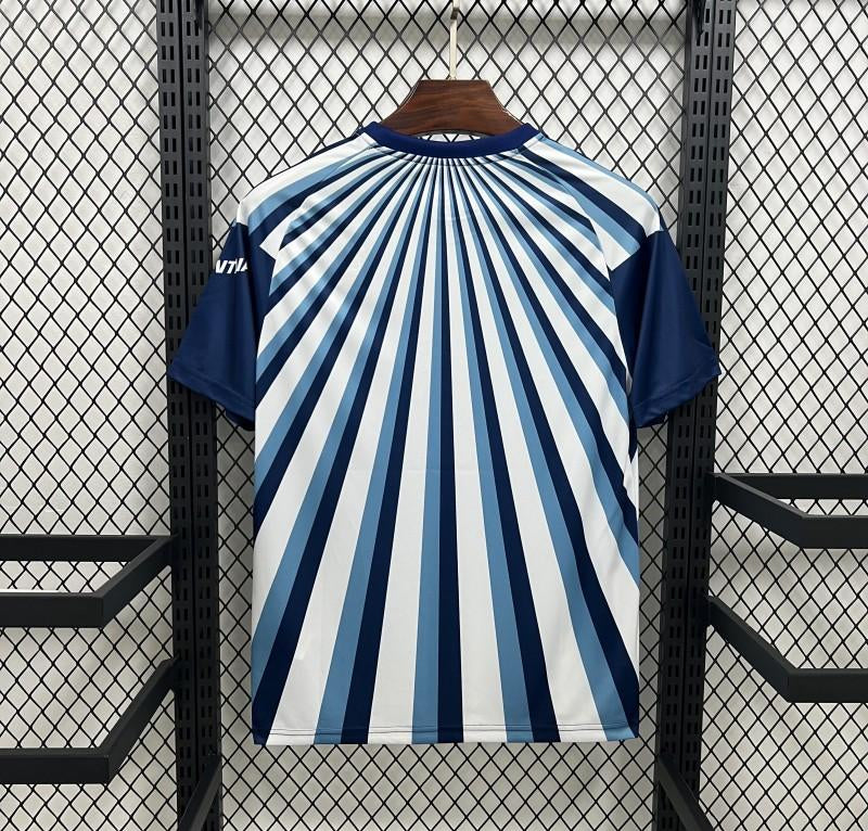 Blue and white striped shirt on a hanger against a black metal grid background
